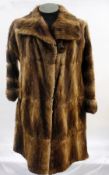 A vintage fur coat, possibly musquash