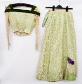 A 19th century green silk skirt and bodice with lace overlay, the bodice trimmed with green