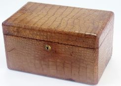 A brown leather jewel box, possibly alligator, with brass fittings and an inner lid (no key)