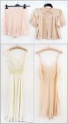 A vintage satin blouse, a pair of satin bloomers, slips, nightdresses, lace borrow and satin nightie