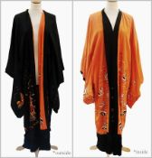 A Japanese embroidered silk kimono, reversible from orange to black, embroidered with pagoda,