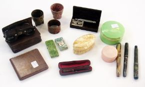 A selection of bakelite items including:- egg cups, razor, bowl, napkin rings, cigarette holder,