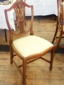 A set of six Rackstraw Hepplewhite-style lightwood dining chairs, each with shield back, wheat ear