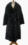 1970s black mink coat, size medium, triangular buttons   Live Bidding:  Repairs to underarms of