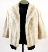 A blonde mink jacket, the lining embroidered with National Fur Company