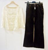 Various vintage garments including corduroy bell-bottom trousers, a Victorian satin blouse, a