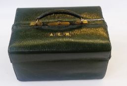 A green leather Asprey vanity case, with various pockets, blindstamped initialled in gold "A.E.W"
