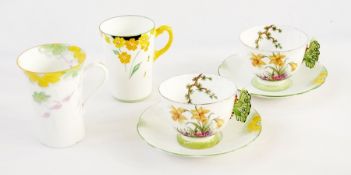 An Aynsley cup and saucer with butterfly handle (af) and two other decorative cups (4)