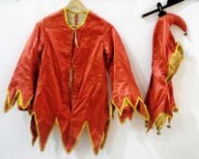 An early 20th century satin Punch costume, red jacket, blue waistcoat and the cap and bells (1 box)
