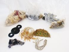 A large quantity of beadwork trimmings, bead tasselled light shades, cut steel and similar