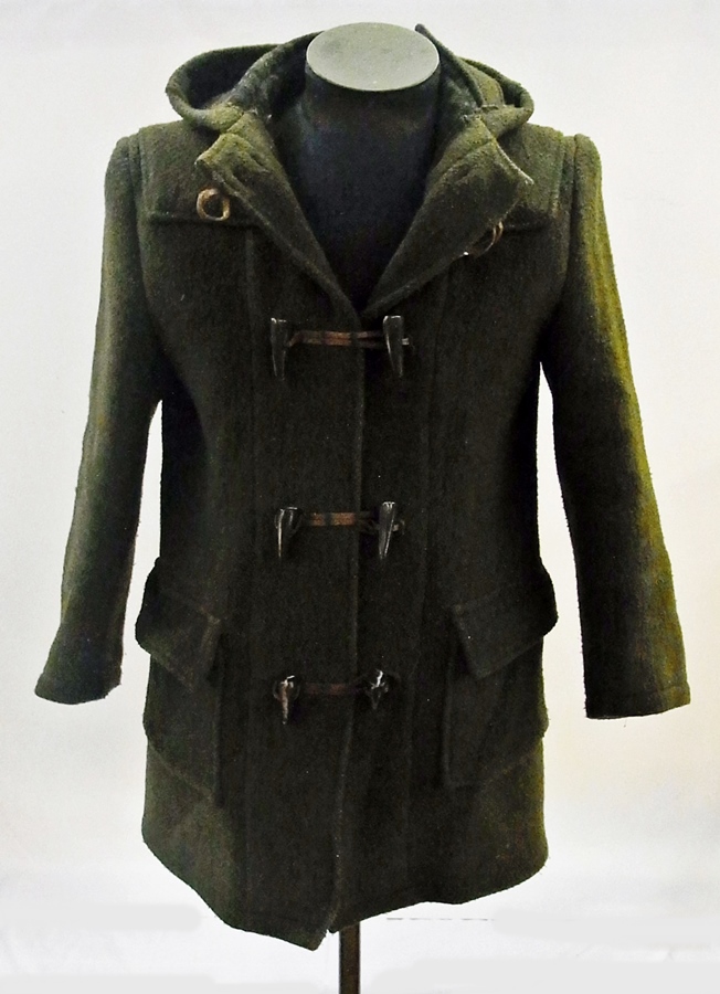 A vintage duffel coat labelled "Traditional British Duffel Coat", olive green with tartan lining and