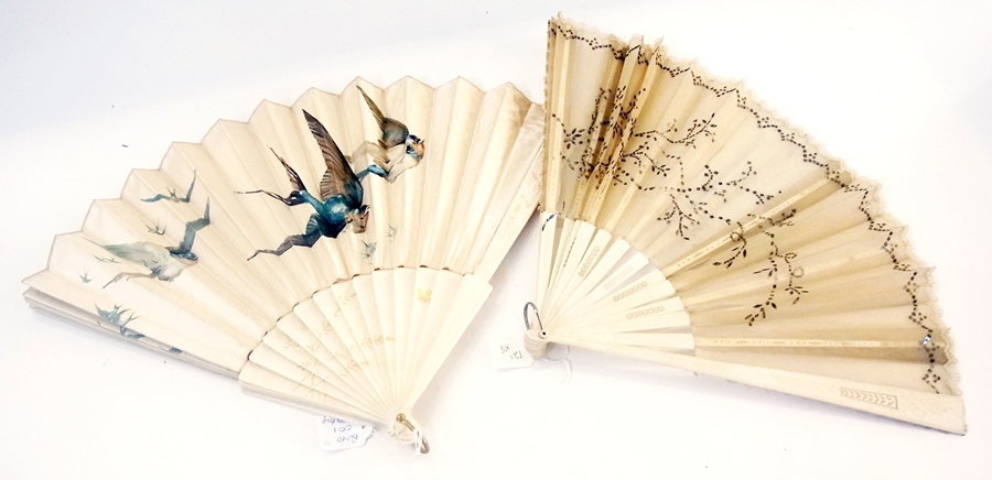 A bone, gauze and sequin folding fan, the gauze leaf decorated with stylised foliate scrolls and
