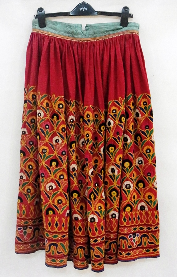 An elaborately multi-coloured embroidered Indian skirt with mirrored insets and a 1970's Indian - Image 3 of 3