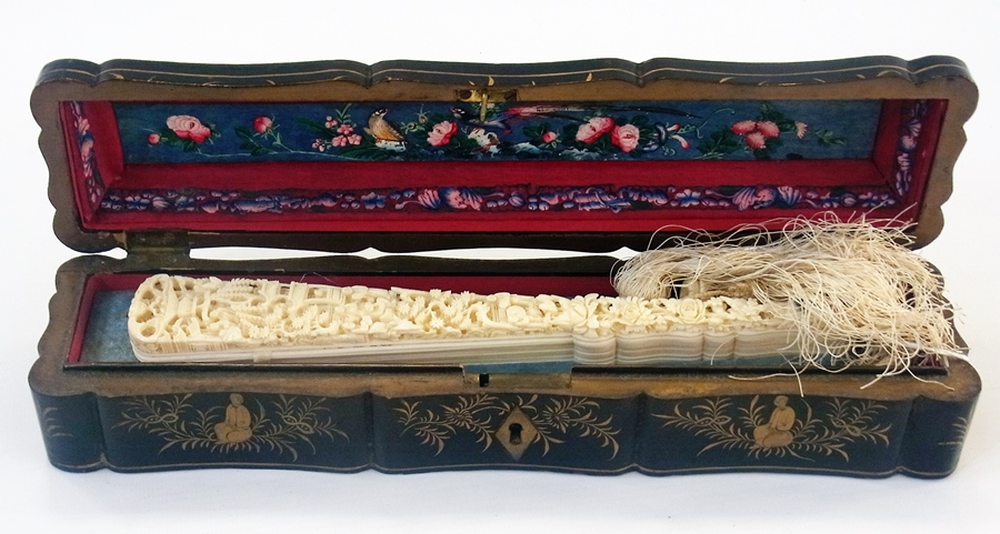 A Chinese ivory brise fan, relief carved guard sticks, in gilt lacquered box - Image 2 of 5