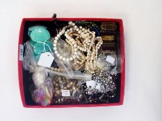 A quantity of costume jewellery to include beaded necklaces, bangles, earrings, etc. (1 box)