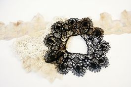 A long length of black lace deep border, possibly silk auvergne, a wide length of ecru lace,