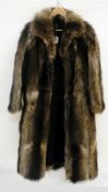 A vintage full-length raccoon coat