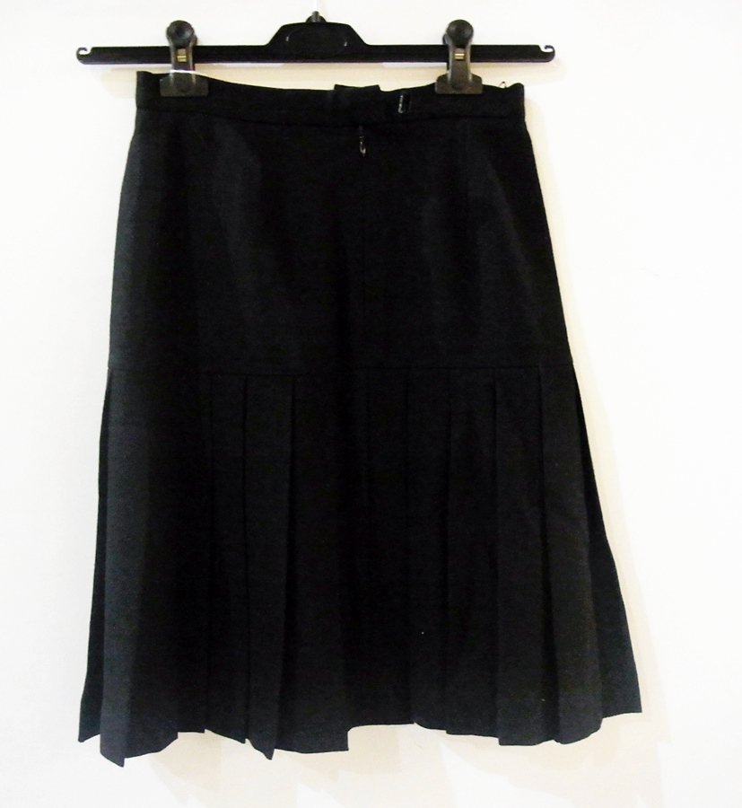 A black Chanel pleated skirt