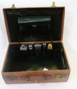 A Mappin & Webb leather suitcase, dressing case with some fittings and blind stamped initials "W.S.