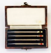 A cased set of four sterling silver bridge propelling pencils