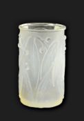 A Lalique opalescent glass cylidrical vase in "Laurier" pattern no.947, inscribed No.947 to base,