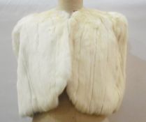White coney shoulder cape and a gentleman's black tail suit (2)