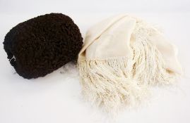 A brown Persian lamb muff with zip and internal purse, with a cream silk deeply fringed shawl (2)