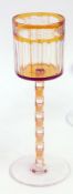 Otto Prutscher by Meyr's Neffe cased and cut amber stemmed wine, the cylindrical bowl panelled