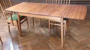A walnut extending dining table by Kenneth Desmond Lampard, Cotswold School, rectangular-shaped,