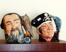 Royal Doulton character jug 'Long John Silver' and another 'Merlin' (7")