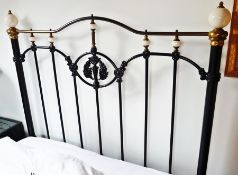 A Victorian iron and brass rail headboard, 4'4"