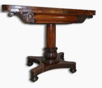 A mid 19th century mahogany fold-over card table, the tapering cylindrical pedestal with carved