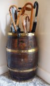 A coopered oak and brass bound barrel as a stick/umbrella stand
