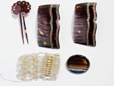 A pair 19th century pique and tortoiseshell hair combs, each with serpentine border and gold
