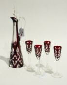Bohemian-style cut and overlaid glass liqueur decanter and four matching stem liqueur glasses