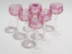 Set of six pink flashed and cut hock glasses, each with serrated stem