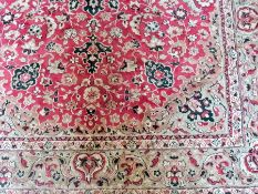 Persian style rug, red ground with cream foliate decoration