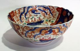 A pair of large Imari bowls, with wavy rims (one af), 31cm diameter