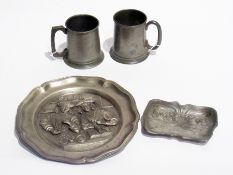 Osiris Art Nouveau pewter pin tray, pewter plaque embossed with figures and two pewter ale mugs