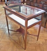 An Edwardian mahogany and satinwood inlaid bijouterie table, on square tapering legs, the cross