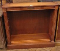 A modern mahogany free-standing bookcase, on plinth base, 97cm wide