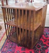 An oak revolving bookcase. with four shelves with slatted sides, width 51cms