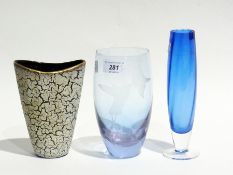 A blue engraved glass vase, ovoid and tall, decorated hummingbird, blue footed glass vase and a