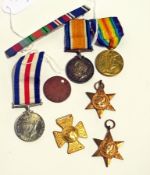 Two WWI medals, another WWII, a Queen Victorian 1887 jubilee medal, France and Germany Star, 1939-45
