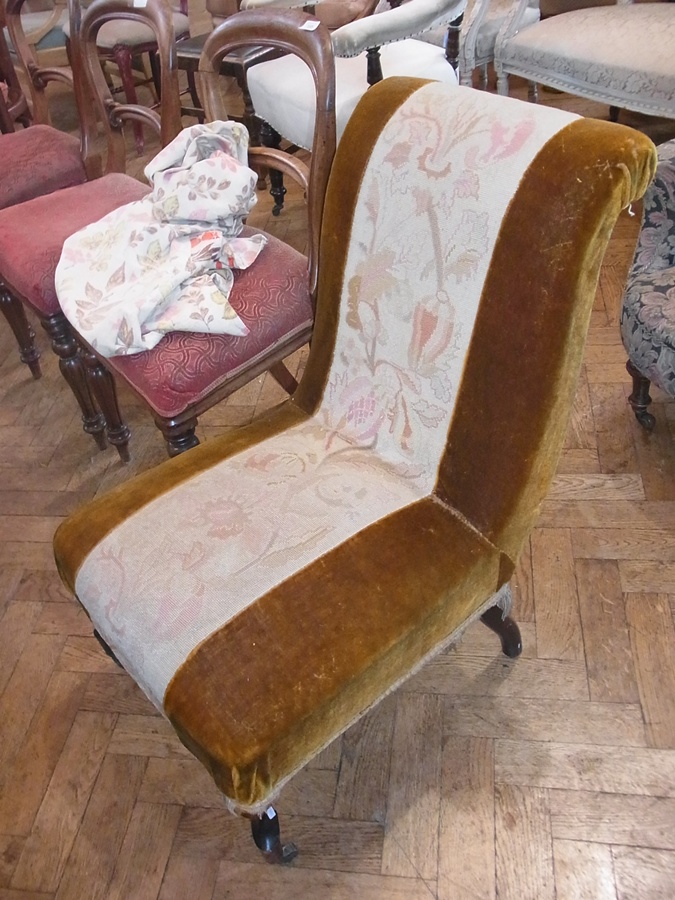 An upholstered nursing chair, on mahogany supports and castors

   Live Bidding:  Please note if