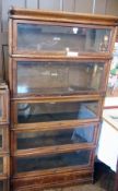 A Globe-Wernicke oak bookcase with "The Globe Wernicke Co Ltd" plaque to inside, of five tiers, 86cm