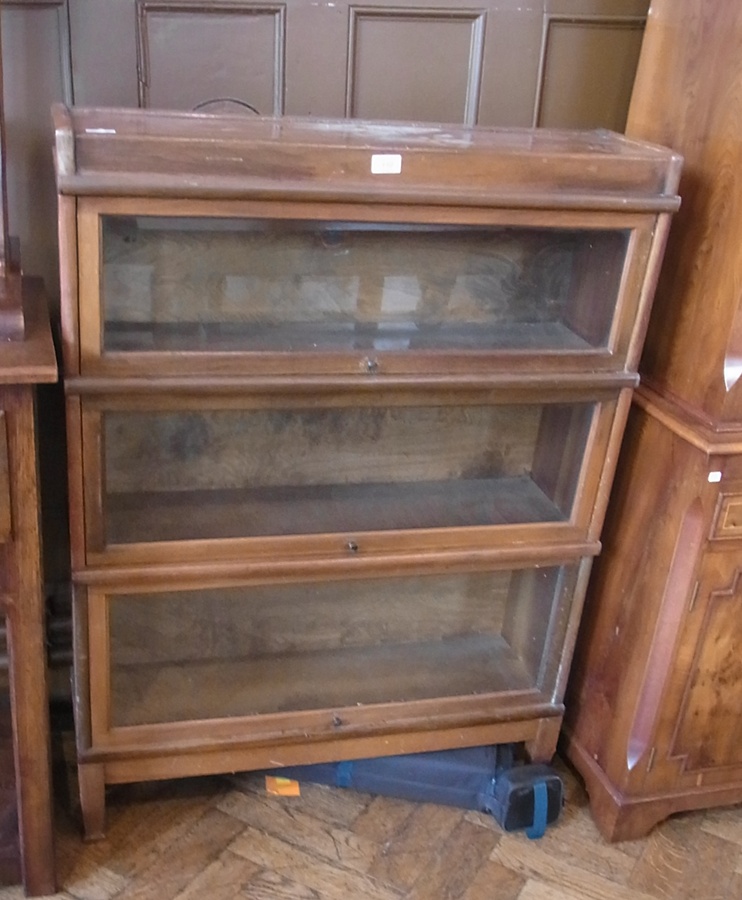 A Globe-Wernicke bookcase with three shelves, on tapering supports, 86cm wide