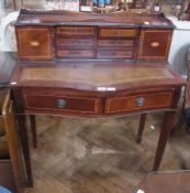 A reproduction mahogany ladies writing desk, with shelf top, the back with six small drawers and a