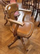 A 20th century oak office swivel chair and two wooden carvers (3)

   Live Bidding:  Please note