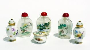 Three oriental glass snuff bottles with red stopper, a pair of miniature Dresden vases with covers